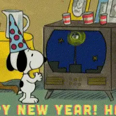 Animeret GIF af Nuser fra Radiserne, der klapper foran en tv-skærm, der viser en nytårsfejring.