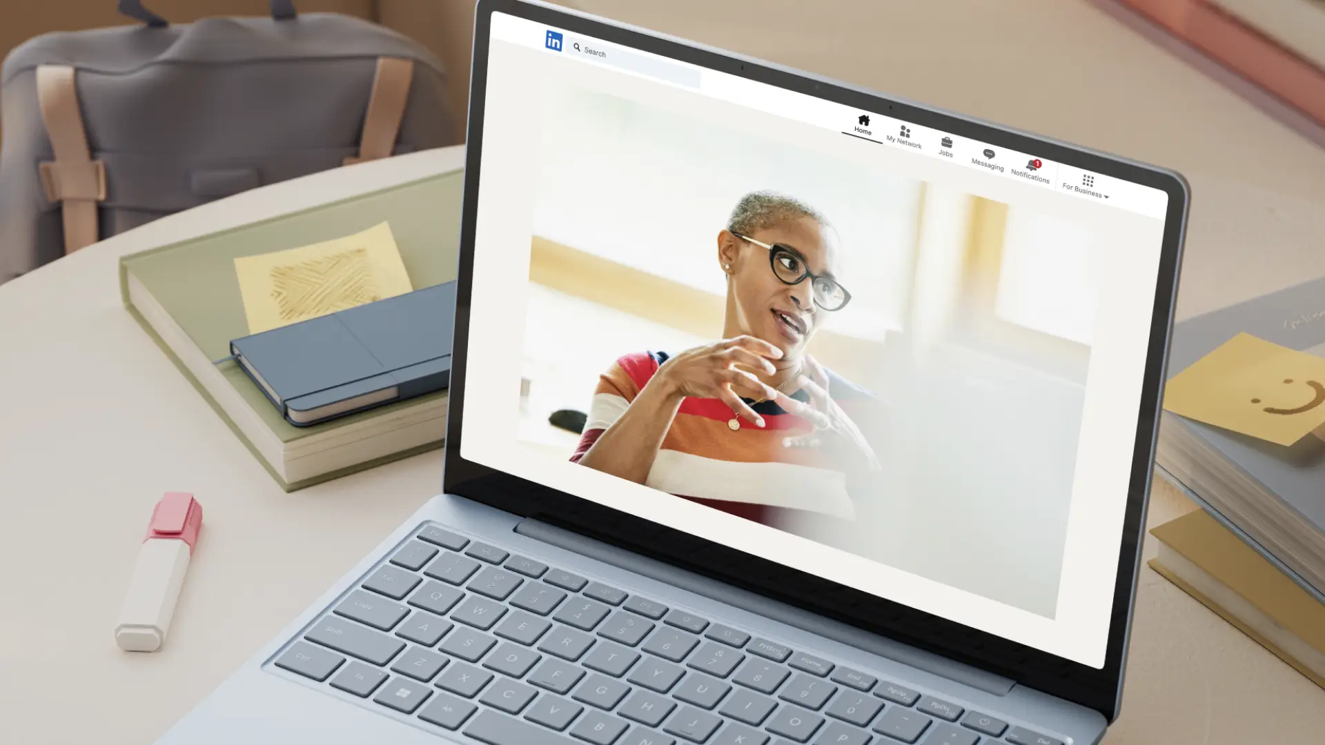 An image of a laptop with a web browser tab opened to LinkedIn.