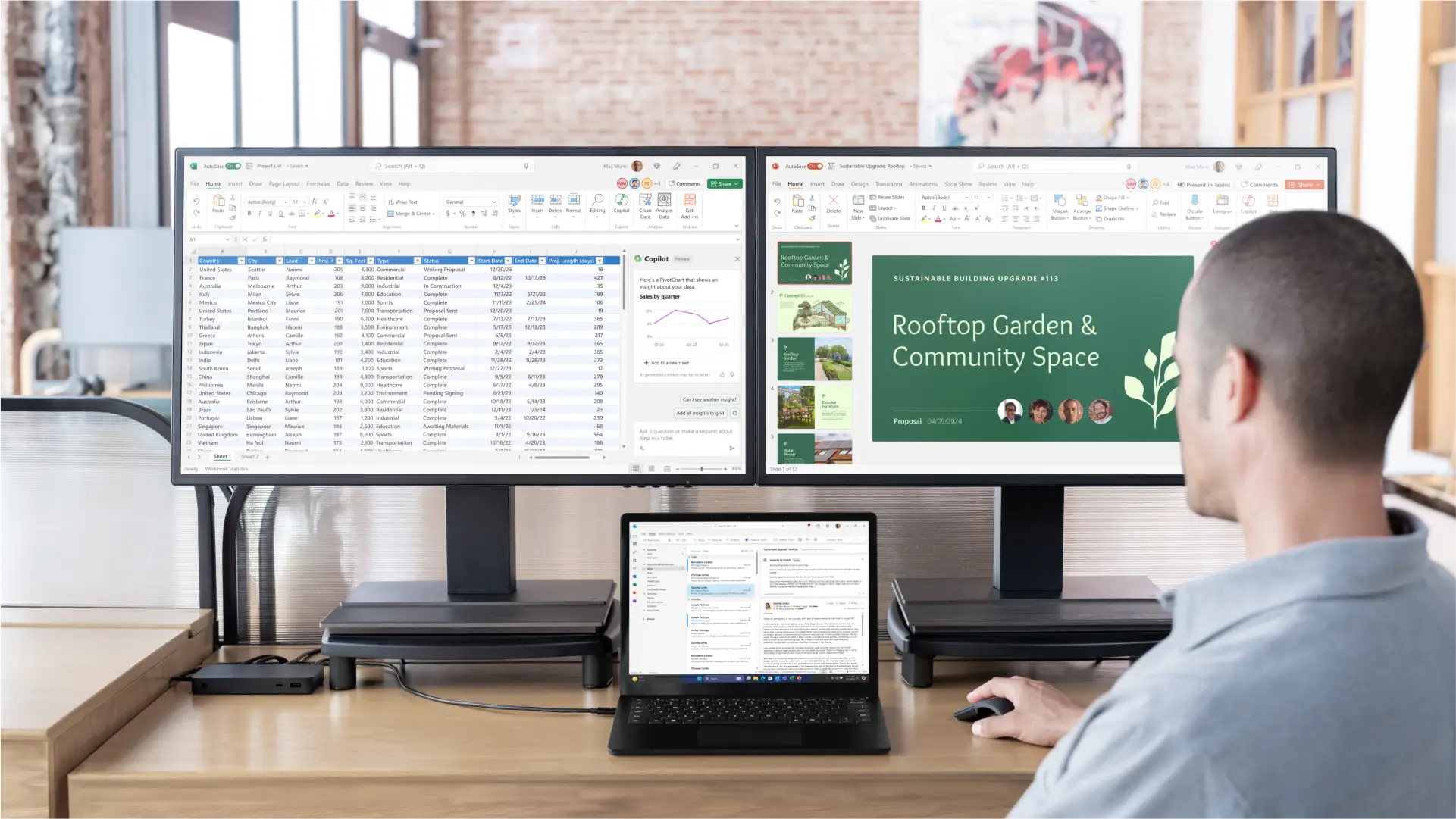 A man working on spreadsheets across three monitors