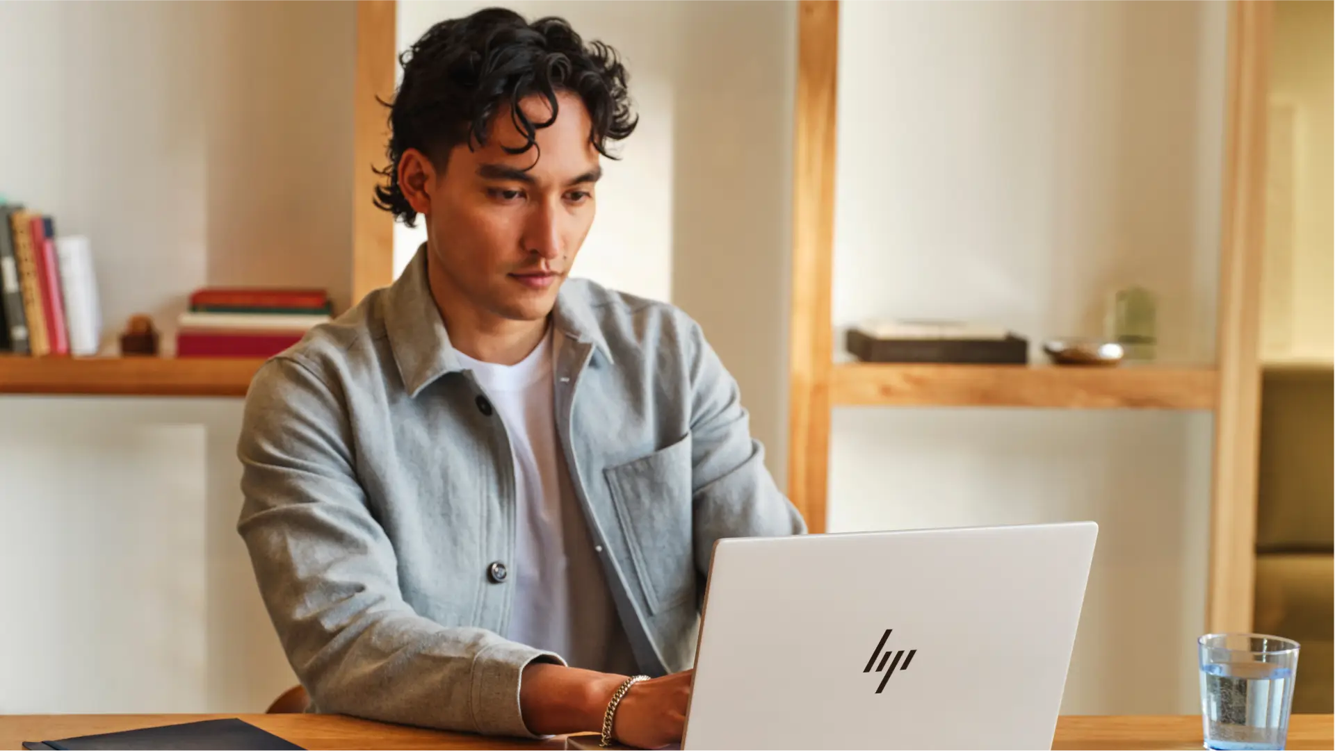 A man on a laptop at a desk