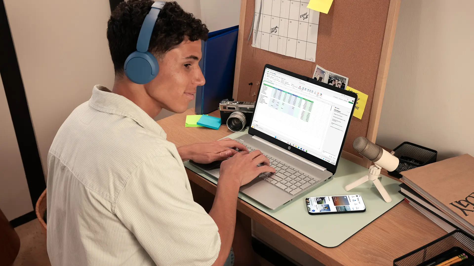 Man on laptop creating an Excel spreadsheet