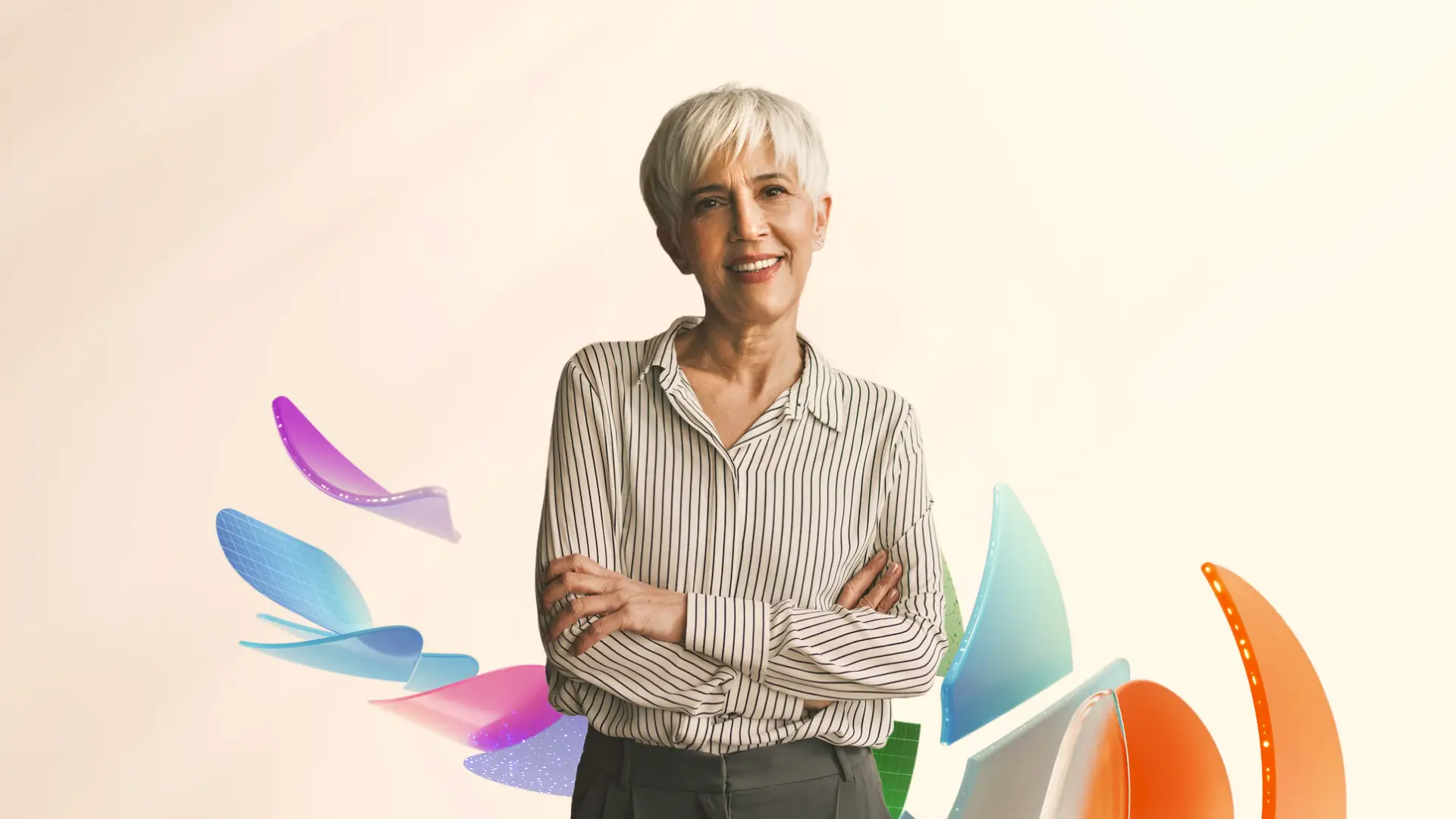 A woman smiling at the camera with her arms crossed in a lifestyle shot.