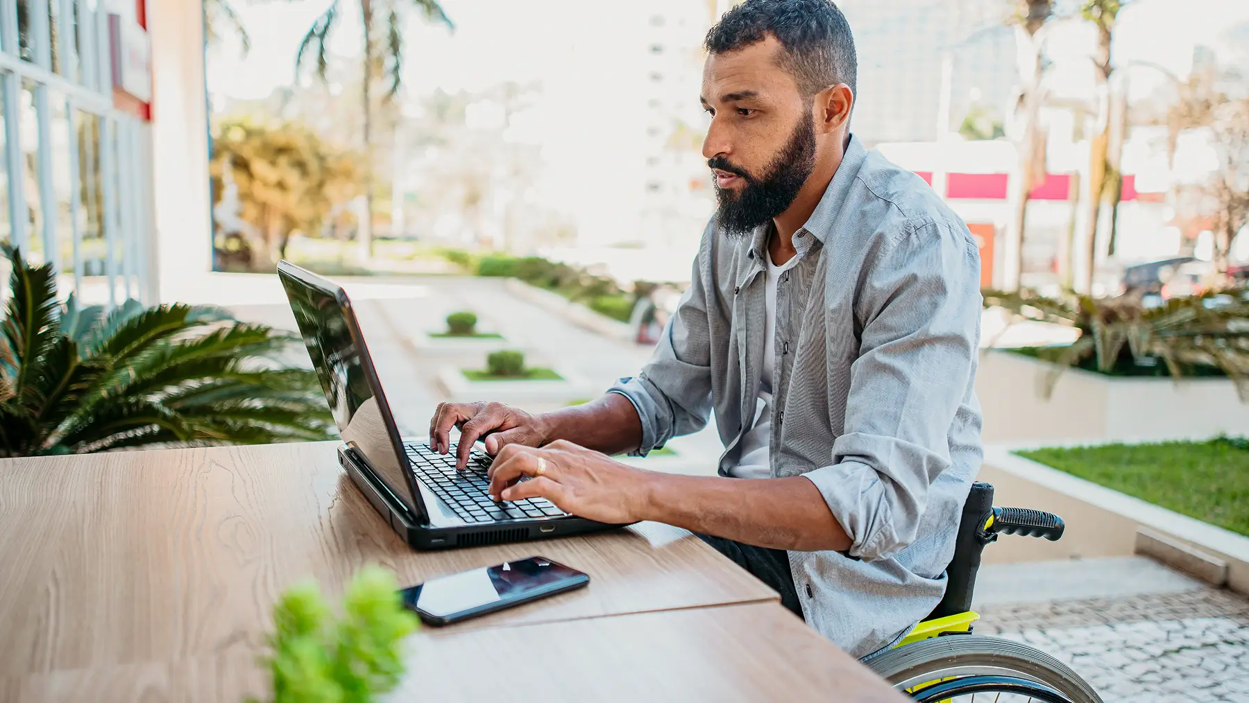 A man typing on a laptop.