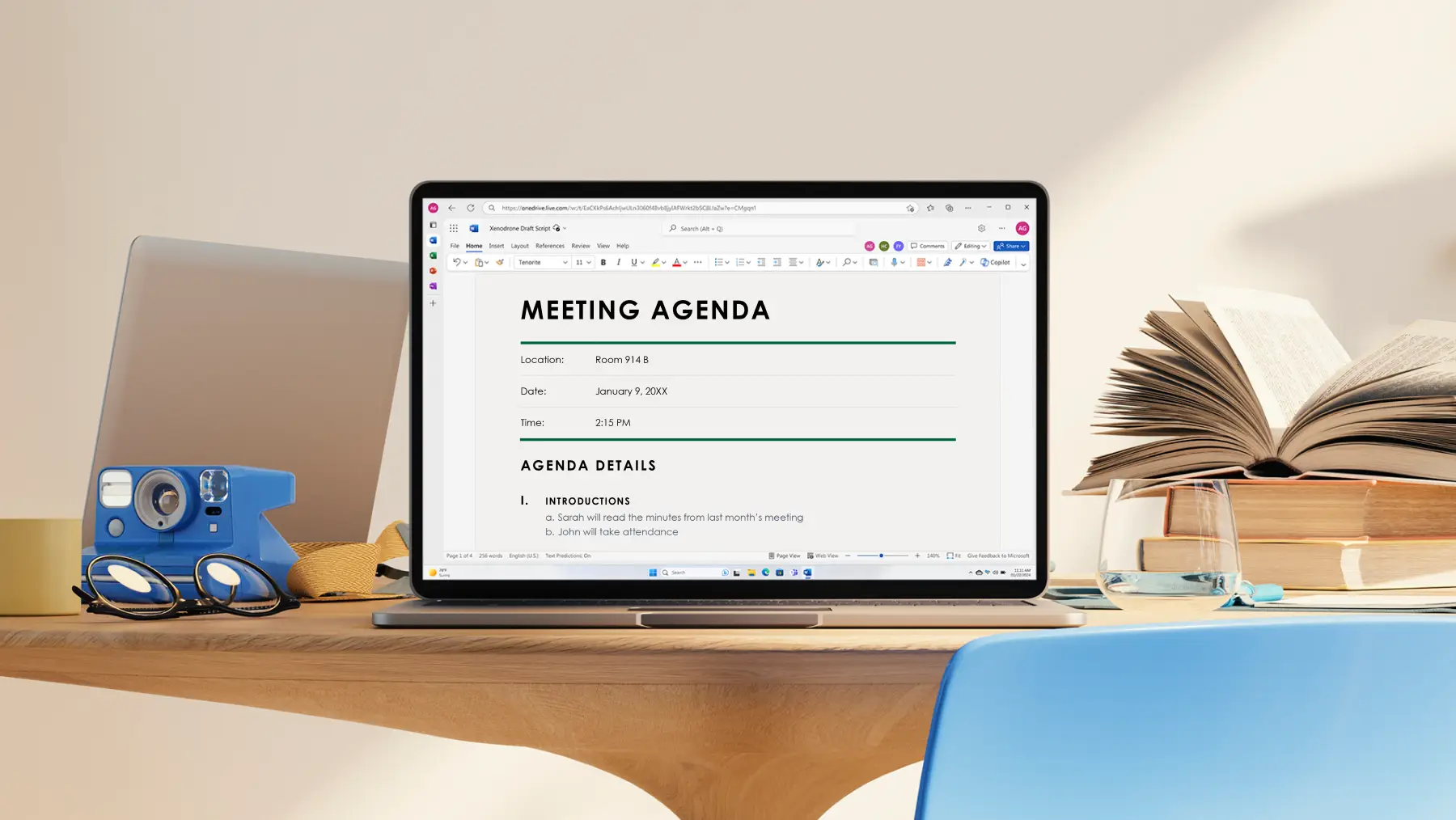 A computer with a meeting agenda document on the screen.